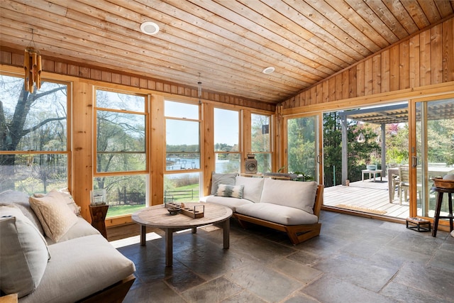 sunroom / solarium with wood ceiling, stone tile flooring, lofted ceiling, a water view, and outdoor lounge area