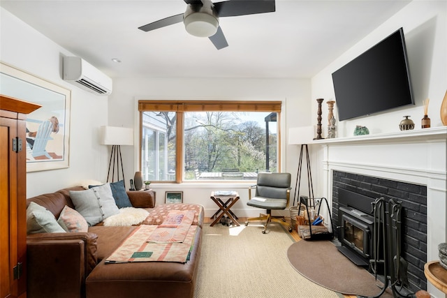 living room with a glass covered fireplace, ceiling fan, and an AC wall unit