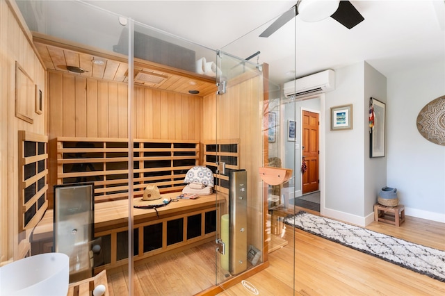 view of sauna with baseboards and wood finished floors