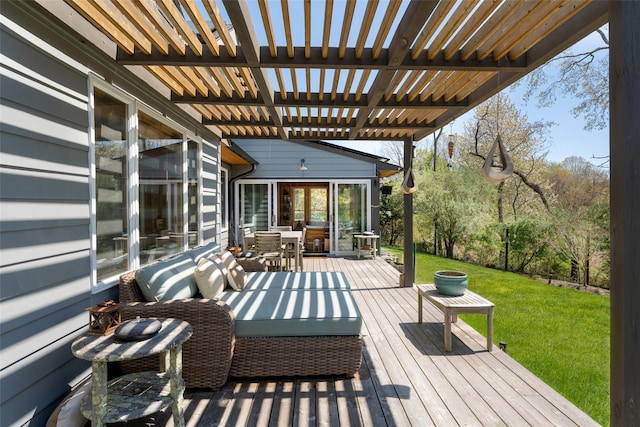 wooden deck featuring a lawn, outdoor dining area, a pergola, and an outdoor hangout area