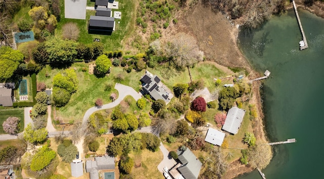 drone / aerial view with a water view and a residential view