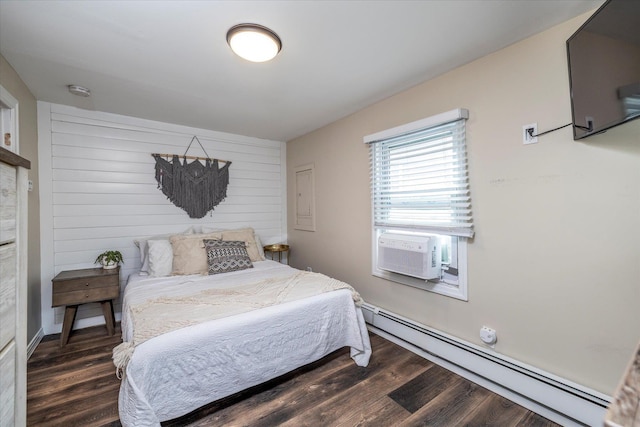 323 New York Ave, Long Beach, NY 11561 - bedroom featuring cooling unit, baseboard heating, and dark wood-type flooring