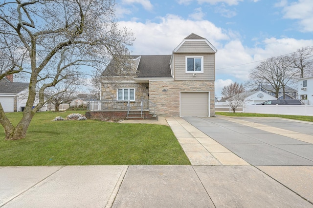 100 Morris Pkwy, Valley Stream, NY 11580 - traditional-style home with a garage, a front lawn, fence, stone siding, and concrete driveway