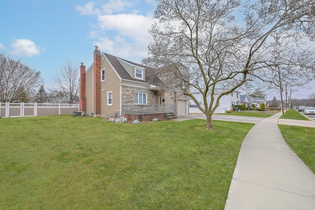 100 Morris Pkwy, Valley Stream, NY 11580 - view of front facade featuring driveway, a chimney, a garage, fence, and stone siding