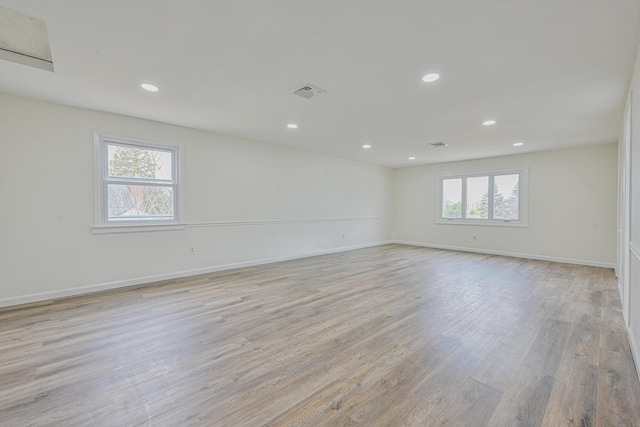 100 Morris Pkwy, Valley Stream, NY 11580 - unfurnished room featuring visible vents, baseboards, a wealth of natural light, and light wood-type flooring