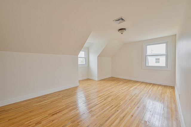 100 Morris Pkwy, Valley Stream, NY 11580 - bonus room featuring light wood-style floors, baseboards, lofted ceiling, and visible vents