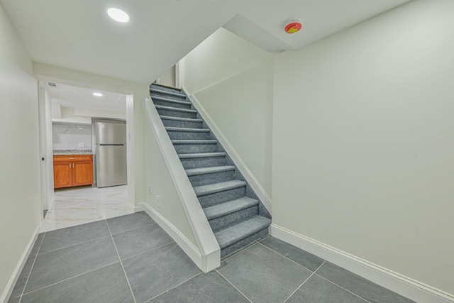 100 Morris Pkwy, Valley Stream, NY 11580 - stairway with recessed lighting, baseboards, and marble finish floor
