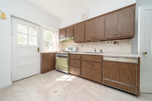 24-10 154th St, Whitestone, NY 11357 - kitchen featuring a sink, dishwasher, light countertops, under cabinet range hood, and gas range oven