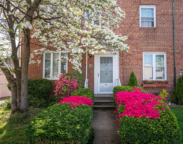 entrance to property with brick siding