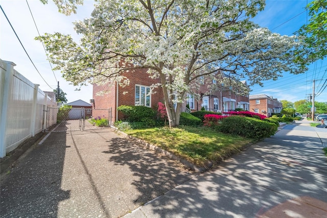 24-10 154th St, Whitestone, NY 11357 - view of front of home with brick siding, fence, and a gate