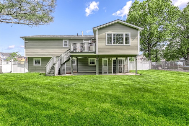 back of house featuring stairs and a wooden deck