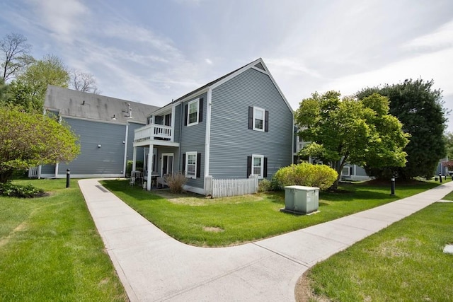 800 Commons Way Unit B, Fishkill, NY 12524 - view of property exterior featuring a balcony and a lawn
