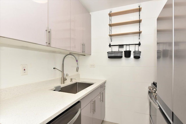 kitchen featuring tile walls, open shelves, a sink, light stone counters, and stainless steel appliances
