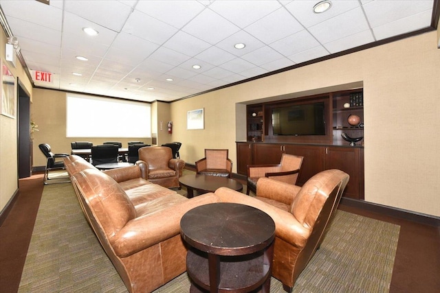 carpeted cinema with baseboards, ornamental molding, and recessed lighting