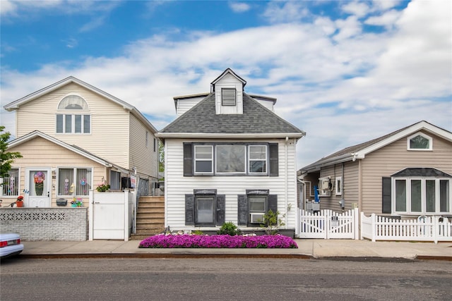 14-11 Cross Bay Blvd, Broad Channel, NY 11693 - view of front facade with a gate, a fenced front yard, and a shingled roof