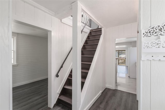 14-11 Cross Bay Blvd, Broad Channel, NY 11693 - staircase featuring wood finished floors, wooden walls, and baseboards