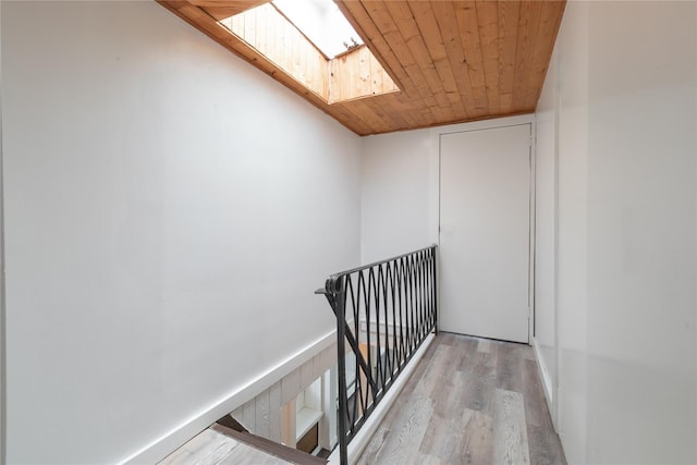 14-11 Cross Bay Blvd, Broad Channel, NY 11693 - staircase featuring wood finished floors, a skylight, and wooden ceiling