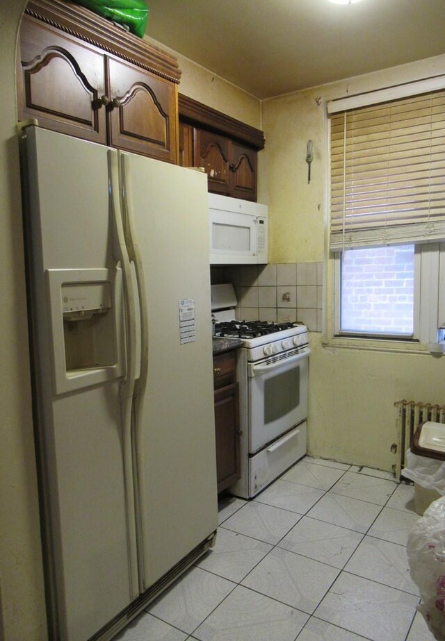 3248 Hone Ave, Bronx, NY 10469 - kitchen with radiator and white appliances