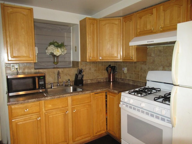 3248 Hone Ave, Bronx, NY 10469 - kitchen with a sink, white appliances, tasteful backsplash, under cabinet range hood, and dark countertops