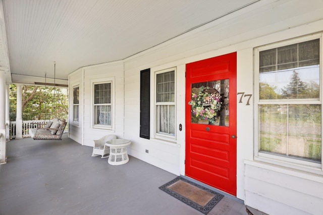 entrance to property featuring a porch
