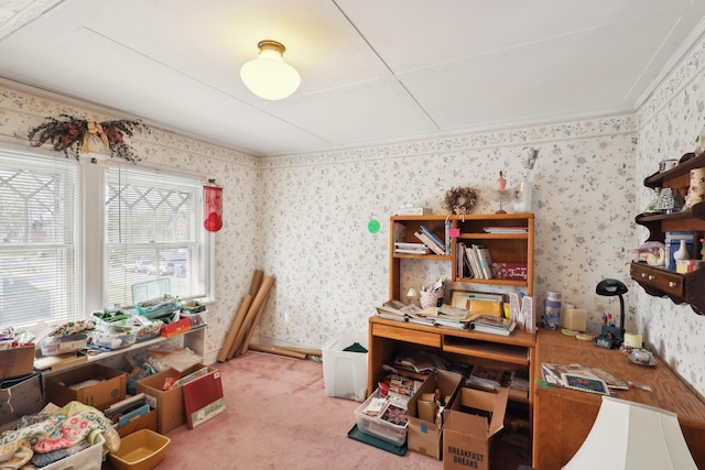 carpeted home office featuring crown molding and wallpapered walls