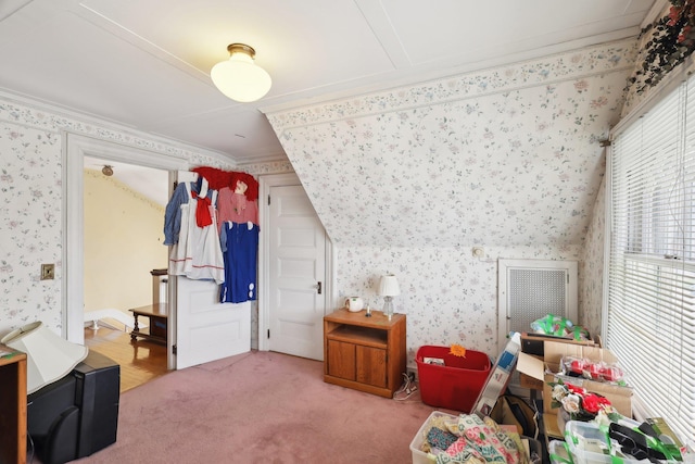 bonus room with carpet floors and wallpapered walls