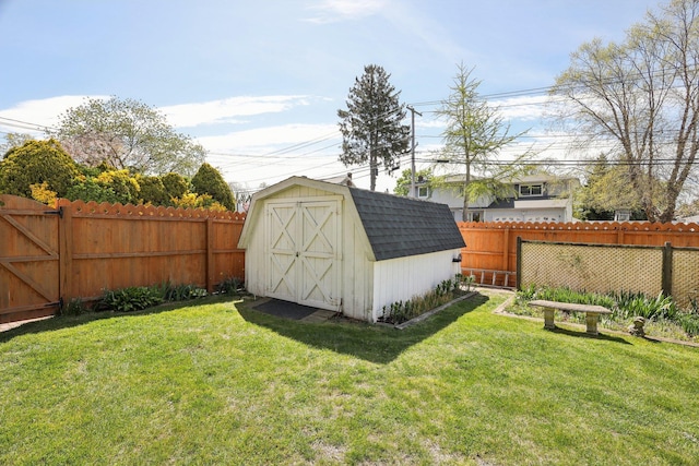 view of shed with a fenced backyard