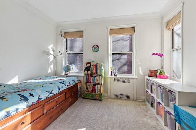 bedroom featuring radiator heating unit, crown molding, and light carpet
