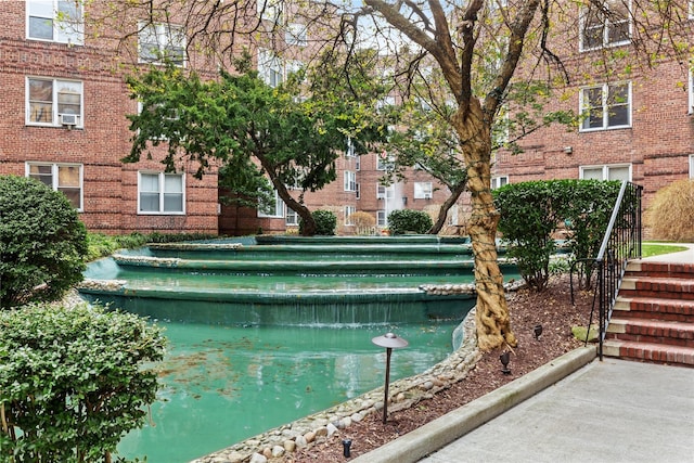 view of swimming pool with cooling unit