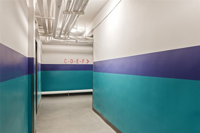 corridor featuring concrete flooring