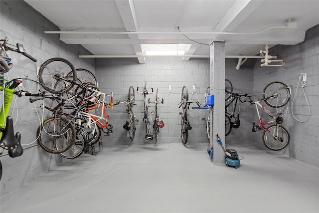 garage featuring bike storage and concrete block wall