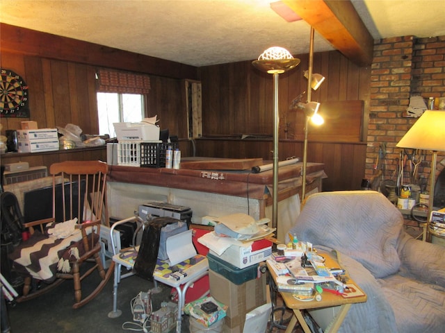 interior space featuring wood walls and beamed ceiling