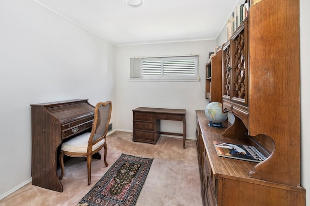 home office featuring crown molding, baseboards, and light colored carpet