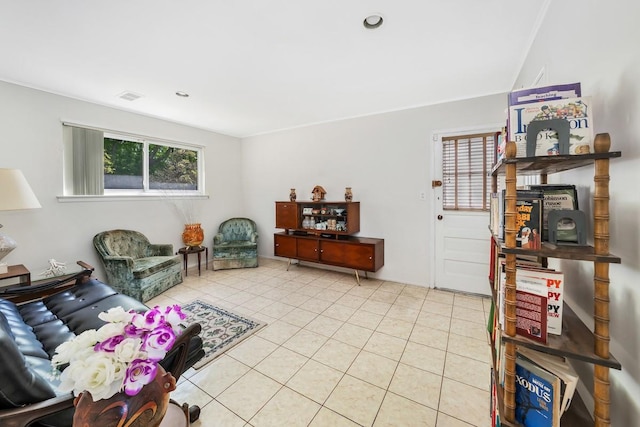 living room featuring tile patterned flooring and visible vents