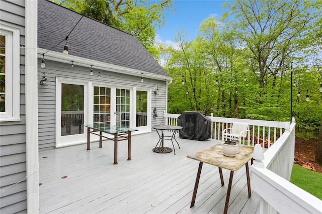 wooden deck with grilling area