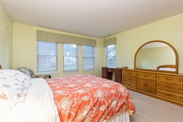 bedroom featuring light colored carpet