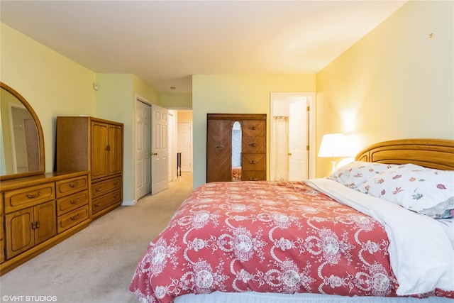 bedroom with light carpet