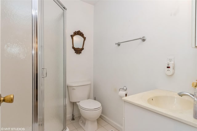 full bathroom featuring a stall shower, vanity, tile patterned floors, baseboards, and toilet