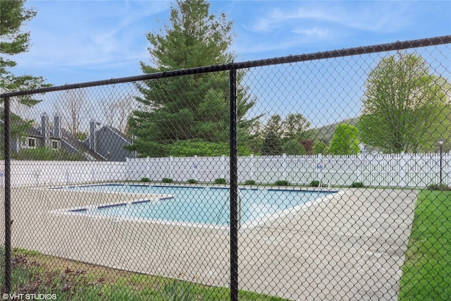 view of pool with fence