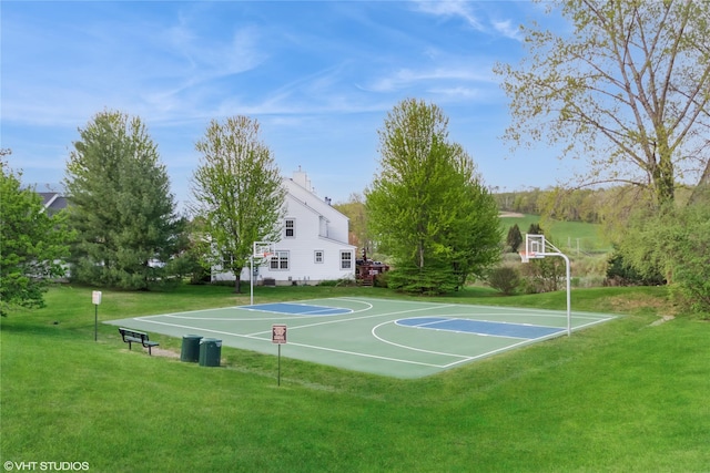 view of sport court featuring a lawn and community basketball court