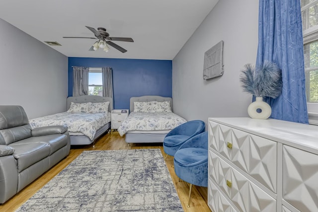 bedroom with wood finished floors and ceiling fan