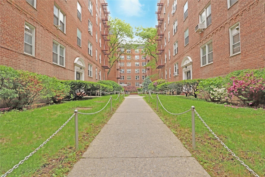 144-41 Sanford Ave Unit 6A, Flushing, NY 11355 - view of community featuring a lawn