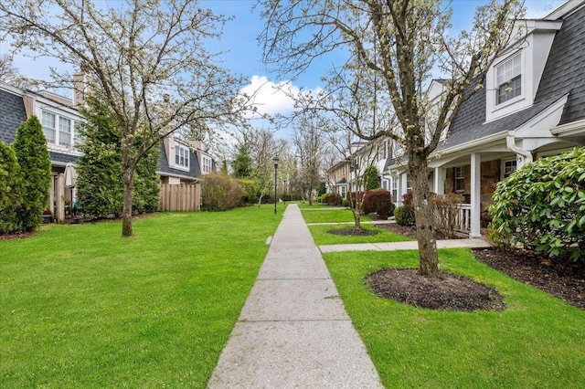 view of yard featuring fence and a residential view