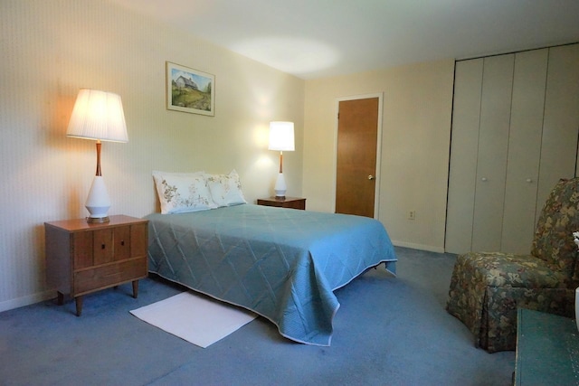 bedroom featuring baseboards and carpet flooring