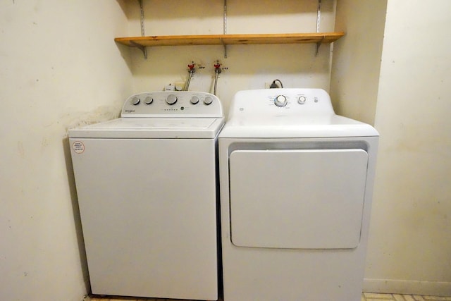 laundry area with separate washer and dryer and laundry area