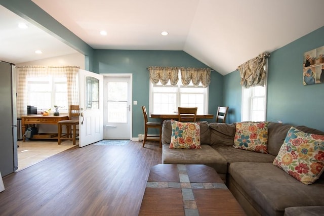 living area with baseboard heating, vaulted ceiling, wood finished floors, and recessed lighting