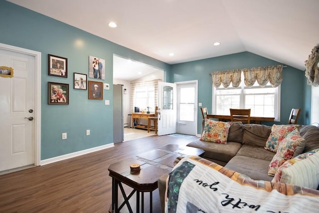 living room featuring baseboards, recessed lighting, wood finished floors, and lofted ceiling