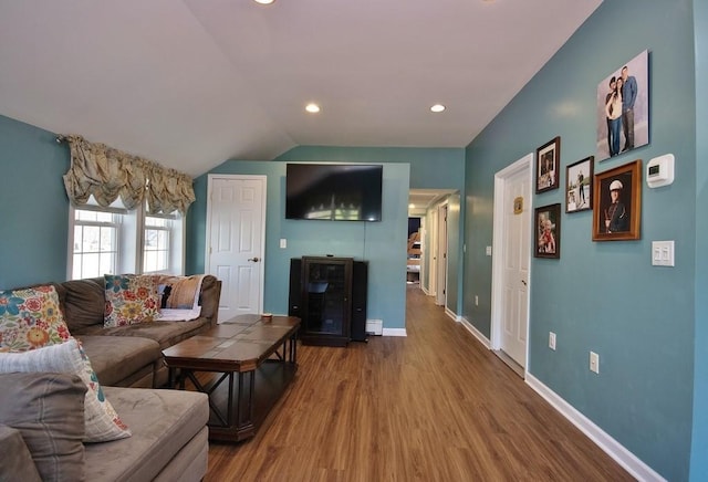 living room with baseboards, vaulted ceiling, recessed lighting, and wood finished floors