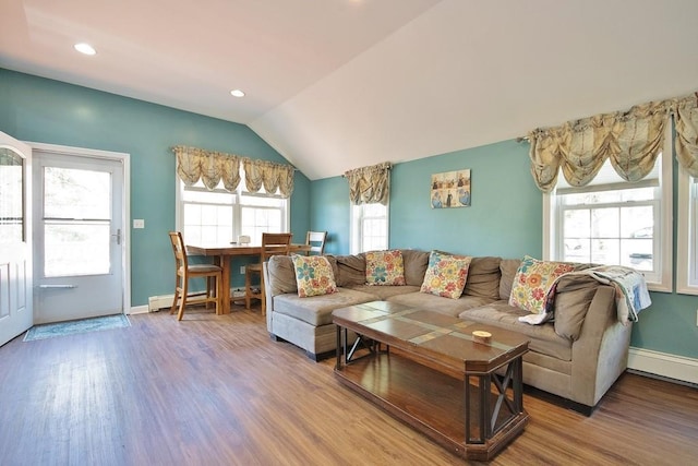 living room featuring baseboards, recessed lighting, wood finished floors, and lofted ceiling