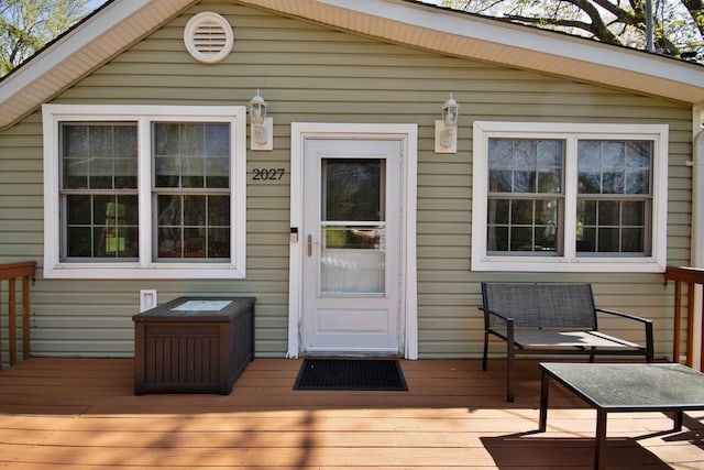 doorway to property featuring a wooden deck